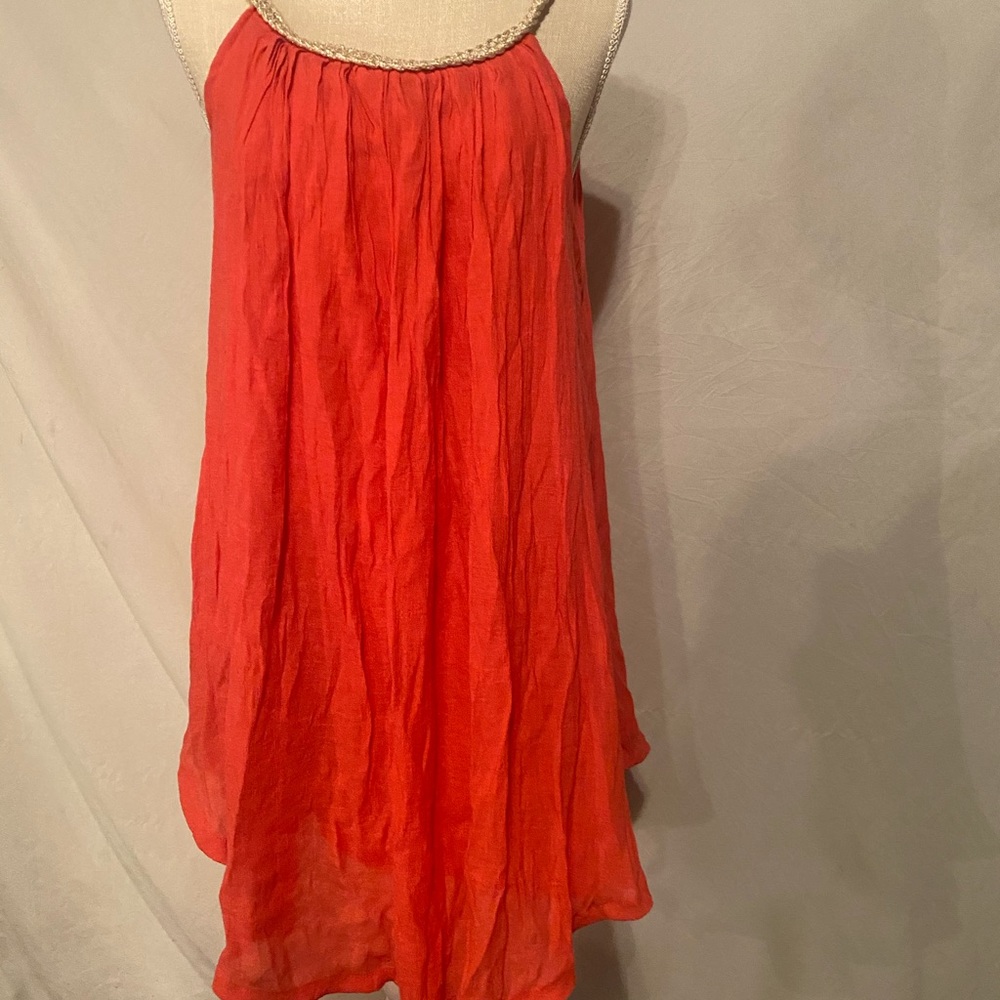 Cute coral summer dress with gold trim neckline